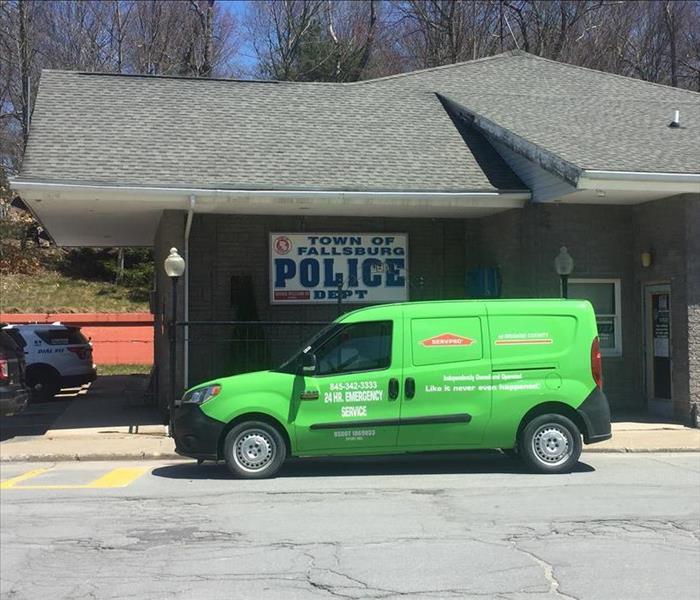 Green SERVPRO vehicle outside Fallsburg police department.